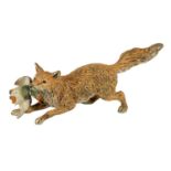 AN EARLY 20TH CENTURY AUSTRIAN COLD PAINTED BRONZE SCULPTURE OF A FOX CARRYING A DUCK