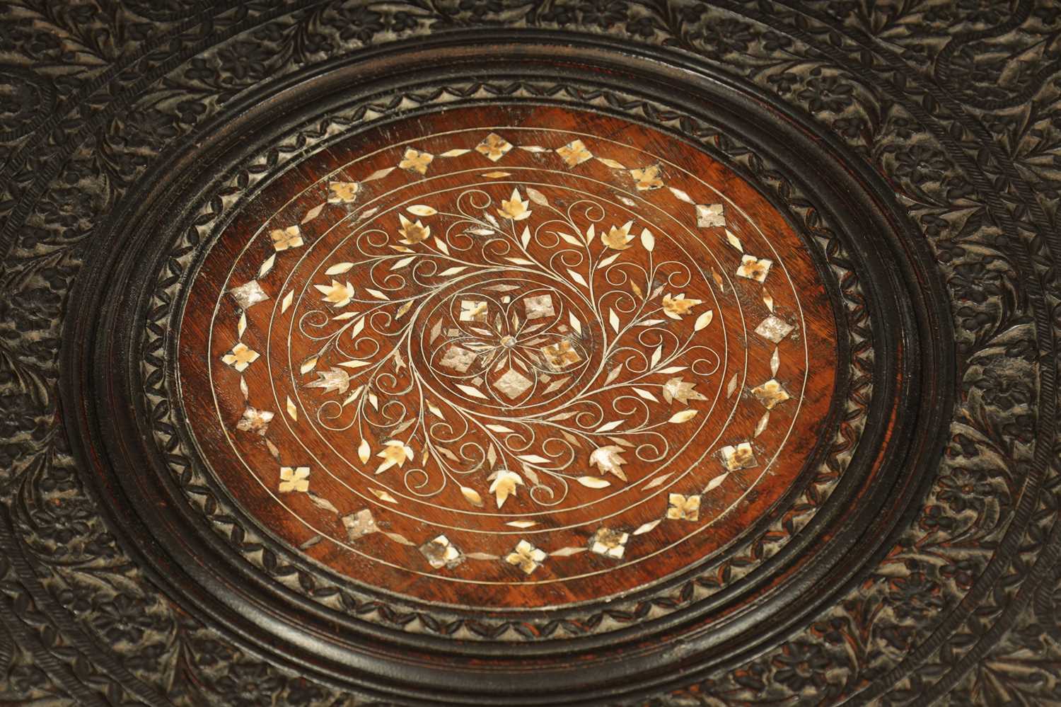 A 19TH CENTURY CARVED HARDWOOD ANGLO-INDIAN FOLDING OCCASIONAL TABLE PROBABLY BURMESE - Image 3 of 10