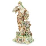 AN 18TH CENTURY BOW PORCELAIN STANDING FIGURE OF FLORA