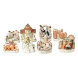 A COLLECTION OF EIGHT 19TH CENTURY STAFFORDSHIRE COTTAGES AND FIGURE GROUPS