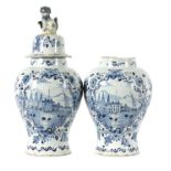 A PAIR OF 18TH CENTURY BLUE AND WHITE DELFT VASES AND COVER