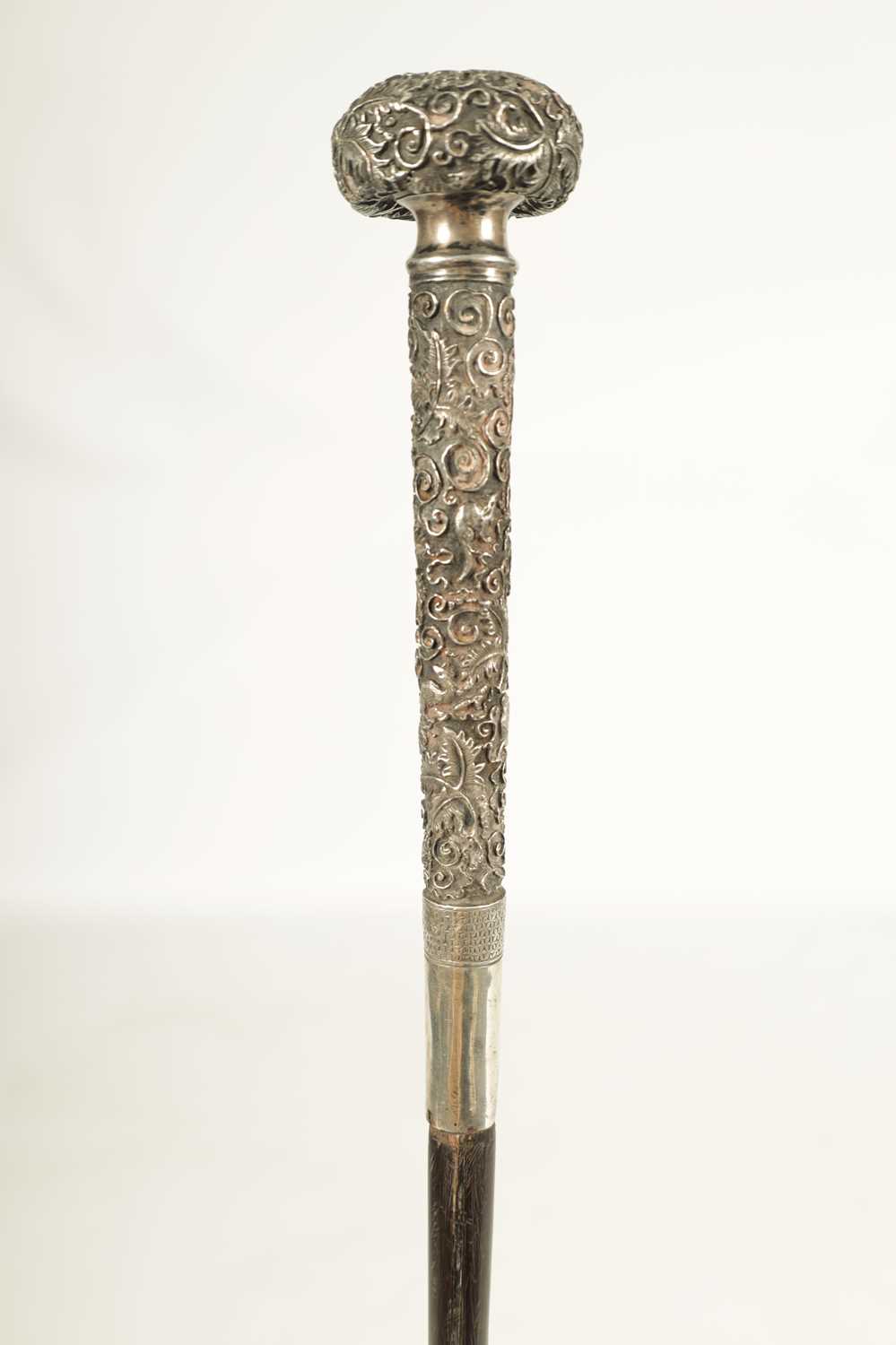 A LATE 19TH CENTURY CHINESE SILVER MOUNTED RHINOCEROS HORN WALKING CANE - Image 3 of 13