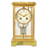 A LATE 19TH CENTURY FRENCH CHAMPLEVE ENAMEL, ONYX AND BRASS FOUR GLASS MANTEL CLOCK