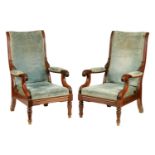A PAIR OF LATE REGENCY UPHOLSTERED MAHOGANY RECLINING OPEN ARM CHAIRS WITH PULL-OUT ANGLED LEG RESTS