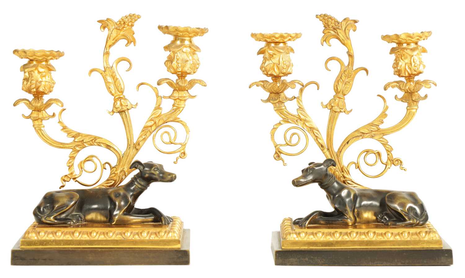 A PAIR OF REGENCY BRONZE AND ORMOLU TWO BRANCH CANDELABRA