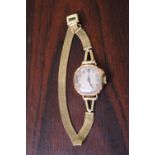 Ladies 9ct Gold wristwatch with numeral dial and gilt bracelet