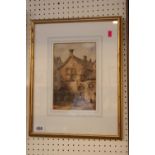 Framed and mounted watercolour of a Town scene monogrammed bottom left M. 16 x 24cm