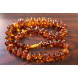 Ladies Amber Necklace of irregular form hand knotted 84g total weight