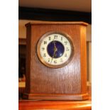 Edwardian Oak cased Mantel clock with numeral dial and Fleur De Lys hands