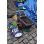 Novelty Painted concrete Mallard with wheel barrow and a Boot