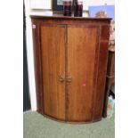Georgian Bow fronted wall corner cabinet with shelved interior