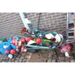 Wheelbarrow of assorted Painted metal garden ornaments