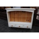 Cream painted wall mounted shelf unit