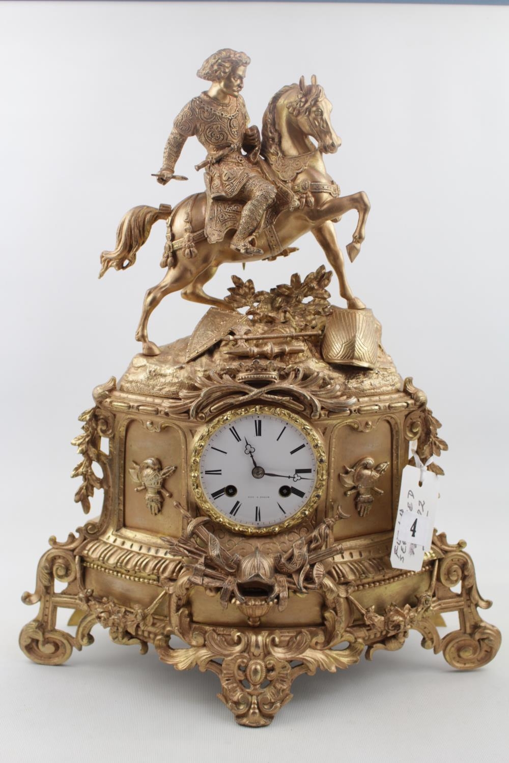 Fine 19thC French Gilded eight day clock with roman numeral dial marked Foy De Paris, with