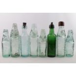 Collection of assorted CLear and green glass Ginger Beer bottles inc Headley Stamford, Carter