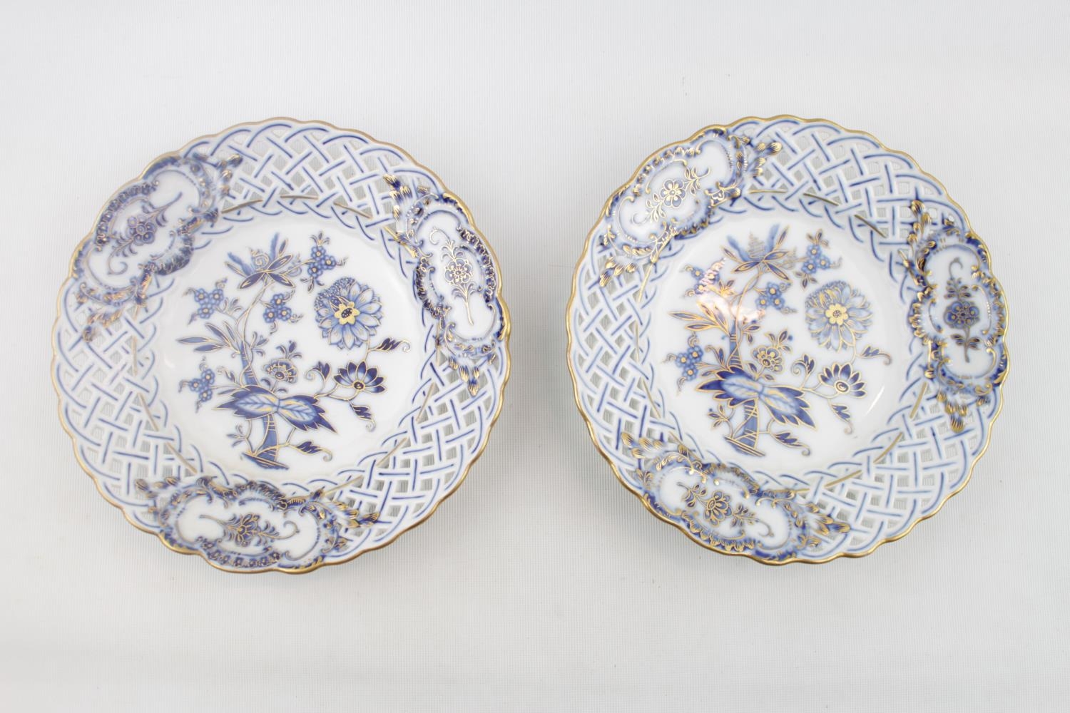 Pair of Meissen Blue Onion Pierced/Reticulated Plates with overpainted gilt detail. 20cm in Diameter