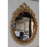 Ornate Ribbon gesso framed oval mirror
