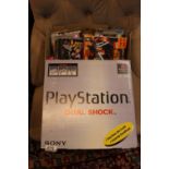 Boxed Playstation and assorted games