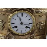 Fine 19thC French Gilded eight day clock with roman numeral dial marked Foy De Paris, with