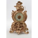 Ansonia clock Co ornate mantel clock with numeral dial with gilded decoration. 20cm in Height