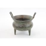 Chinese bronze censor with gilt splash decoration, upturned handles over Tri peg base. 11cm in