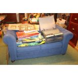 Blue upholstered button back sofa on oak casters