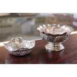 Oriental white metal bon bon dish and another small pierced silver dish, 83g total weight.