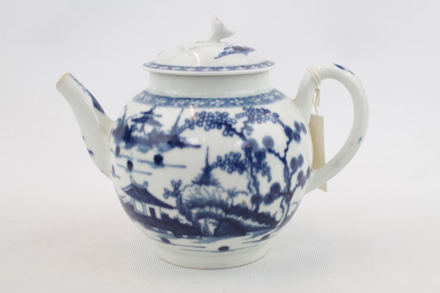 A Worcester blue and white miniature teapot, c1765-70, finely potted and painted with the Prunus.