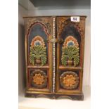 Hand painted Folk ware table cabinet with drawers to interior. 39cm in Height