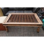 Large Rectangular coffee table with wrought iron and glazed top and caster feet