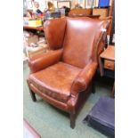 Good quality Brown Leather Elbow chair on straight supports