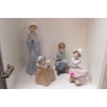 Collection of 4 Nao figurines to include boy with rabbit, Girl with Puppy etc