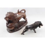 Large Hardwood carved figure of a Lion with Ball and a Hardwood figure of a Lion with Bone Teeth