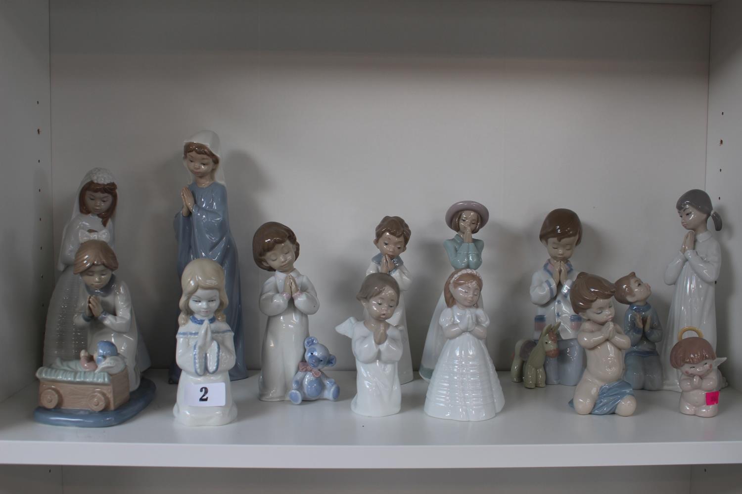 Collection of Lladro and Nao glazed figurines of Praying Figures (13)