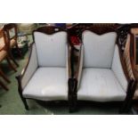 Pair of Edwardian upholstered Elbow chairs with Inlaid detail