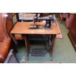 Singer Sewing machine on Oak and metal treadle base