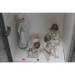Collection of 4 Nao figurines to include Girl with Cat, Girl with Lamb etc