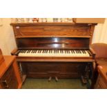 Sebestons of London upright piano in oak case