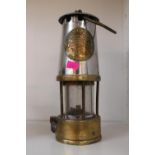 The Protector Lamp & Lighting Co of Eccles no 43 miners lamp of Brass and Chrome construction