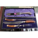 Cased Horn Handled Carving set and a Silver handled Carving Knife