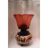 Victorian Pottery based Oil Lamp with Ruby glass shade