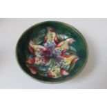 Moorcroft Nut dish with floral decoration on green ground with impressed mark to base