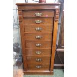 Late Victorian Oak Wellington chest of 8 drawers with brass drop handles with locking section to