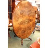 Victorian Burr Walnut Inlaid Oval tilt top table on Carved mahogany base