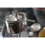 Silver Oval Tea Caddy Birmingham 1887 and a 19thC Silver Scallop Caddy Spoon 133g total weight