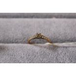 Ladies 18ct Gold Diamond set ring with stone set shoulders. 2.4g total weight. Size M