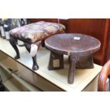 African carved stool on bracket supports and a Upholstered stool with cabriole legs