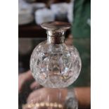 Edwardian Silver topped scent bottle with machined detail over cut glass spherical body