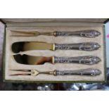 Boxed Set of 4 French Silver handled gilt bladed knives and forks