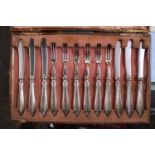Boxed set of Six Dessert Knives and forks with reeded rims. Sheffield 1915
